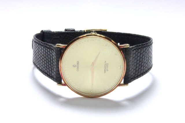 Concord 14k men's watch: Sold at Tiffany & Co. quartz movement with leather band. From the estate of Chris Peckham.