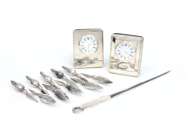 Silver clocks, corner servers, & Tiffany Sterling: Including 1 - Kitney & Co., London clock. Both with velvet backs. 10 - Sterling silver corn servers. 1 - Tiffany Sterling silver letter opener. From the estate of Chris Peckham.