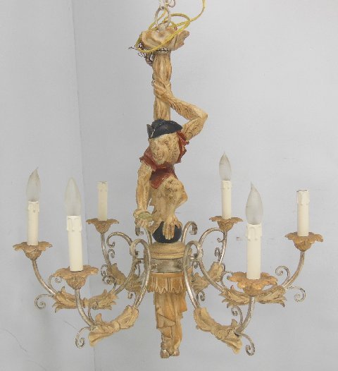 6 arm figural carved chandelier: Modern , monkey motif. Approx. 31" H x 28". From the Estate of Chris Peckham.