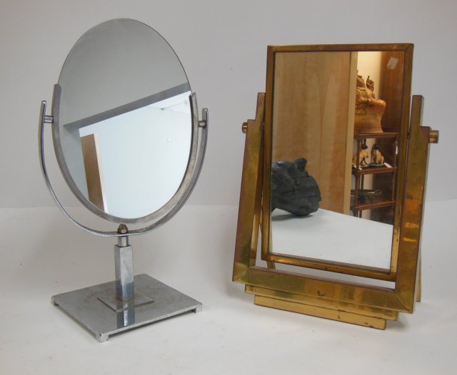 2 Modern dressing mirrors: One chrome, one brass. The largest approx. 19" H. Condition: Brass pitted, chrome slightly pitted. From the Chris Peckham Estate.