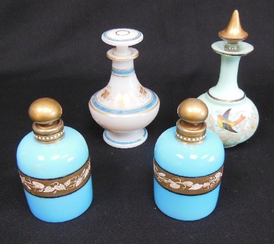 Group of French glass perfumes: Including pair turquoise glass & opaline, and a green glass perfume bottle. The largest approx. 6.25". Condition: Wear to decoration throughout. From the Chris Peckham Estate.