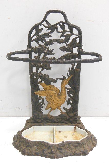 Vintage metal umbrella stand: bird in the forest, paint finish worn, enameled porcelain insert worn, 27"H (From the Estate of Chris Peckham)