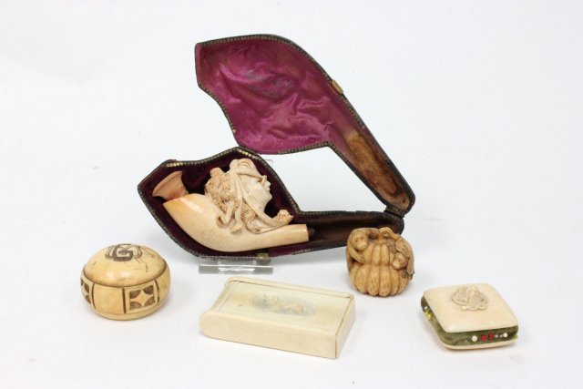 5 carved bone pieces: Meerschaum pipe stem depicting woman with spectacles, pill box with carved dog, monkeys and 2 other pieces (From the Estate of Chris Peckham)