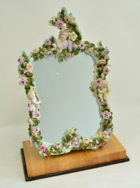 Dresden porcelain mirror ca. 1900-20's: In custom plexiglass case. Mirror approx. 22" H, box 25.5" H.