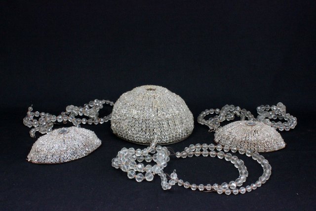 Cut glass basket form chandelier & wall lights: Chandelier approx. 50.25" H x 10.25" D, some beads missing. Pair of wall lights, approx. 8" H. From the estate of Chris Peckham.