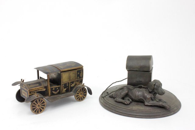 2 figural inkwells: Including 1 - Continental bronze & metal figural inkwell, approx. 6.25" diam. 1 - Tole inkwell modelled as a car. Dog missing parts. Insert car missing 1 insert. From the estate of Chris Peckham.