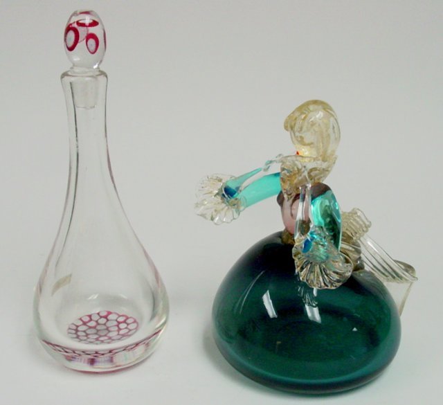 Hand blown Murano "Lady Playing Flute": Murano piece, approx. 9.75" H, chip on flute. With Millifiore crystal decanter, approx. 12" H. From the estate of Chris Peckham.