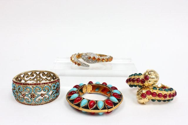 Vintage Kenneth Lane hinged bracelets: Approx. 4 bracelets including 1 circa 1960-70s gold tone w/amber & clear crystals wrap around coil snake bracelet; 1 Mogul style black enamel, turquoise & red colored cabachons bracelet; 1 circa 1960-