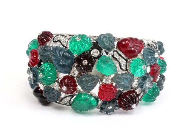 Vintage Kenneth Lane cuff bracelet: Late 1960's, early 1970's "fruit salad" and rhinestone cuff bracelet. Bracelet has red, green, blue and amethyst color resin leaves with clear rhinestones and black enamel accents in a silver tone rho