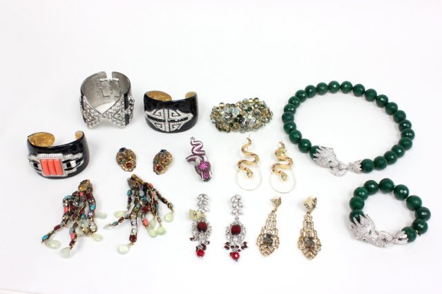 Costume jewelry lot: Including: Approx. 3 Kenneth Jay Lane crystal and black enamel deco cuff bracelets. Dragon necklace and bracelet with green onyx. C & D Jewelry clip-on earrings with multi-colored stones. Dragon jewel