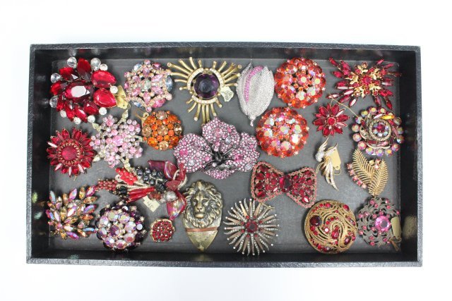 Colorful crystal and rhinestone brooches: Approx. 28 vintage brooches including pieces by Kenneth J Lane. From the estate of Anita Stern, owner of This-N-That antiques store, NYC.
