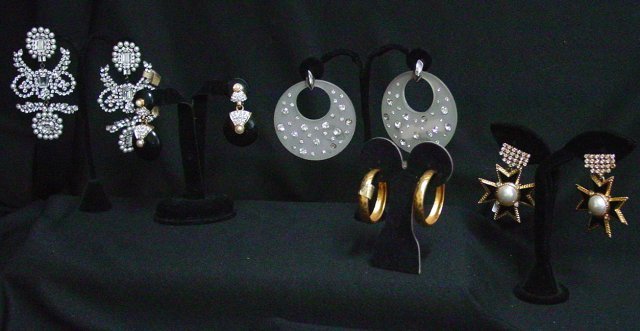 Kenneth Lane costume earring lot: Includes1 pair of rhinestone and pearl chandelier earrings with faceted emerald and round cut rhinestones. Early mark, approx. 4" drops. 1 pair of black enamel, pearl and rhinestone earrings. Early ma