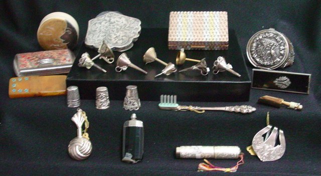 Assorted sterling and lucite collection: Approx. 19 items including thimbles, needle cases, perfume flask, tooth brush, manicure set, perfume funnels, smoney clip, change purse, an 800 silver compact and a lucite case. From the estate of Ani