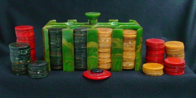 Bakelite poker chip set: Set comes with red, black and tan colored poker chips. From the estate of Anita Stern, owner of This-N-That antiques store, NYC.