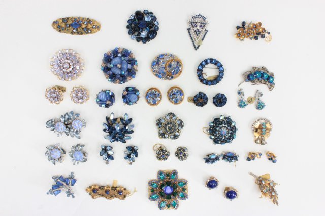 Blue colored rhinestone & crystal earrings & pins: Approx. 20 sets. Includes pieces by Miriam Haskell and Regency. From the estate of Anita Stern, owner of This-N-That antiques store, NYC.
