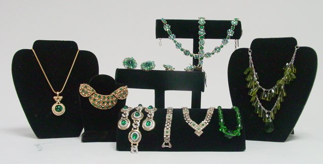 Gold tone rhinestone necklaces & bracelets: Approx. 7 pieces with emerald colored stones. Includes pieces by Hattie Carnegie and Kenneth J Lane. From the estate of Anita Stern, owner of This-N-That antiques store, NYC.