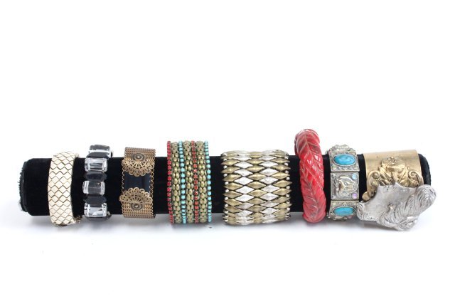 Lucite, brass and jeweled bracelets: Approx. 8 bracelets including a heavily carved bakelite bracelet and pieces by Miss Ellie and Ciner. From the estate of Anita Stern, owner of This-N-That antiques store, NYC.