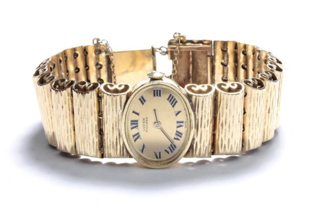 Lucien Piccard 14kt gold ladies watch: Approx. 33.8 dwts with works