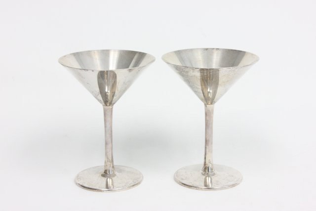 Pair of Cartier sterling silver martini glasses: Approx. 5 1/2"H, 340 grams, 10.9ozt From the Estate of Chris Peckham