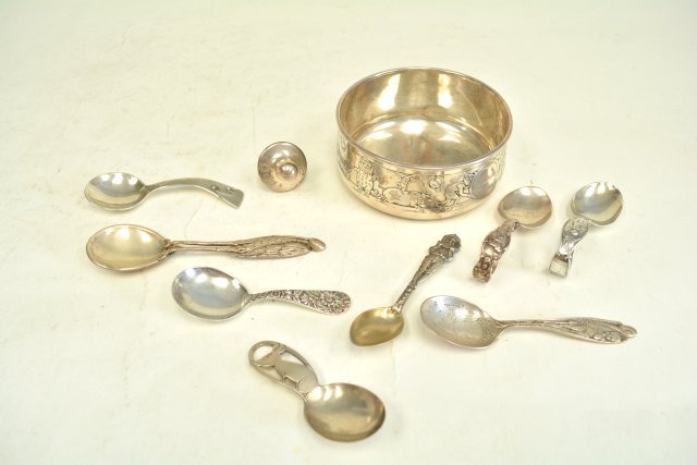 Assorted silver baby items: Including 1 - Gorham cereal bowl depicting "Animals Playing"; 1 - pacifier; 8 - baby spoons, one with a stork which is approx. 5.25" L; 1 - stork & baby; 1 - mouse; 1 - floral piece; 1 - hand wrought 