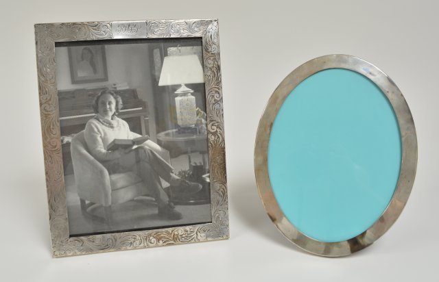Two sterling silver picture frams on easel backs: Including oval Tiffany & Co, NY - 11" x 8 1/2" and 12 1/2" x 9 3/4" Clarence A. Vanderbilt, NY From the estate of Chris Peckham.