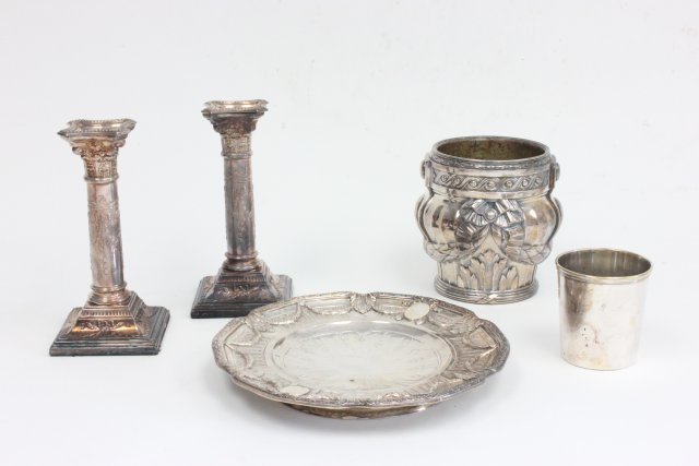 Group lot of French silver plate items: Including pr candlesticks - 7 1/2" h, Christofle cup - 3" h, 9" plate with touch marks, tassle design wine cooler A. Ricler Casse, Paris ribbon design - 5 1/2" h. From the estate of Chris Peckham.