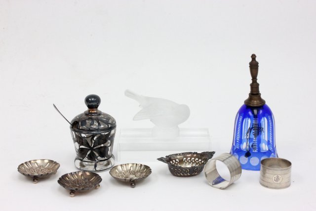 Group lot of sterling silver & Lalique: Including: Lalique "Bird", Sterling silver overlay sugar with sterling silver spoon, 3 Kirk & Sons sterling silver, Gorham nut dish, Bohemian blue cut to clear bell. 7 pieces in total.
