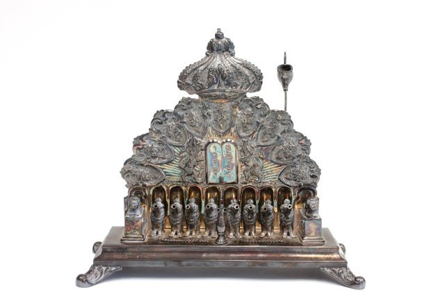 Sterling silver menorah: Oil, with "Lion" decoration. Approx. 14" W x 13.25" H. Approx. 54 ozt.