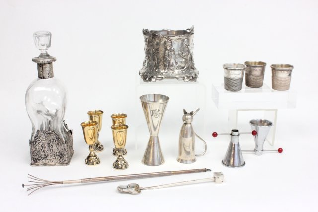 Lot of 14 liquer Dutch silver, WMF, sterling items: Including WMF wine bottle holder adorned with cherubs hunting, 4 gilt vermeil sterling silver shot glasses - 6 1/2 ozt Dutch silver and crystal liquer bottle - 9 1/4" h sterling silver twizzler stick,
