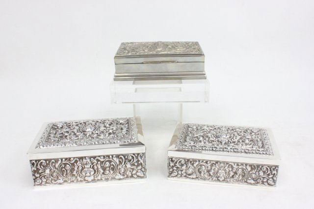 Group lot of 3 repousse silver heavy boxes: 1- 800 silver, approx. 6" W x 4 1/4" D x 2 1/4" H. 1- 800 silver, approx. 5 3/4" W x 4" D x 2" H. 1- Sterling silver approx. 5 1/2" W x 3 1/2" D x 1 5/8" H. With wood liners.