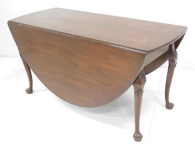 Mahogany drop leaf table: Approx. 58" across x 29.5" H, top 24" with 2- 24" drop leaves.