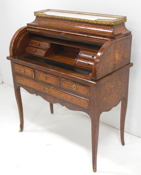 20th c. Cylinder roll French desk: 4 drawers, marble top, "Floral" inlaid with full interior, 1 bronze sabot missing. Approx. 36" W x 18" D x 43" H.
