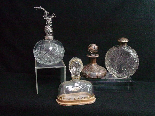 Crystal and Sterling perfume bottles.: Approx. 4 pieces including some by Hattie Carnegie. From the estate of Anita Stern, owner of This-N-That antiques store, NYC.