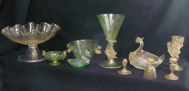 Venetian glass set with fish motif: Venetian glass fish motif consisting of footed compote, 7 goblets with fish stem, 4 cups with fish handles, 1 salt cellar and 10 shot glasses. From the estate of Chris Peckham