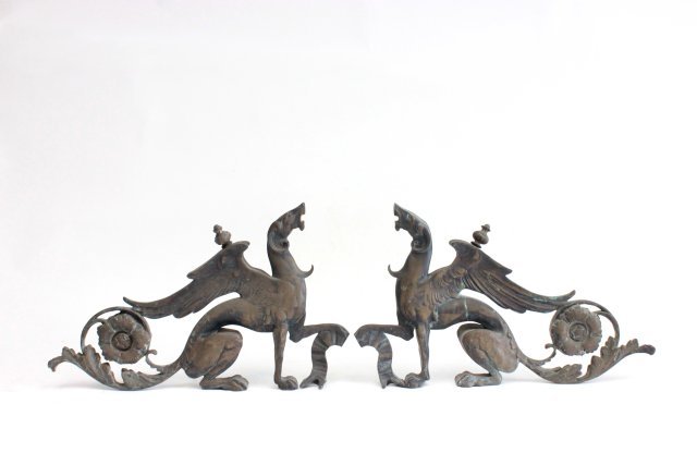 Pair "Griffon" form bronze supports: Patina stained & worn. Approx. 13.5" H x 22.5" W. (From the Estate of Chris Peckham)