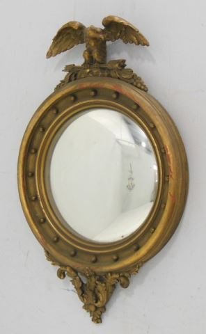 Regency Style Giltwood Convex Mirror with eagle crest: Approx. 38" H x 25" W.