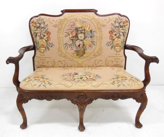 Mahogany needlepoint loveseat ca. 1920's: "Floral" handstiched, carved splayed legs, "Eagle Head" arms, "Shell" carved design. Approx. 53" H at back x 42" x 24" D, seat 43" W x 18" D. (3392)