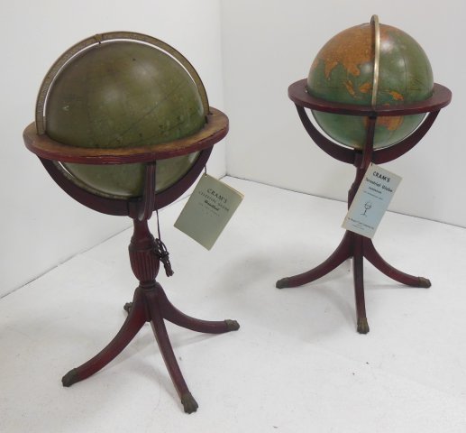 Pair of Cram's terrestrial & celestial globes: 1950's. On original stands with books. Damages. Total height 40".