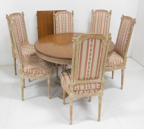Neo-Classical style dining table and six chairs: Table, approx. 29.25 in. H, 42 in. diameter. with one 21 in. leaf. Table is a little loose.