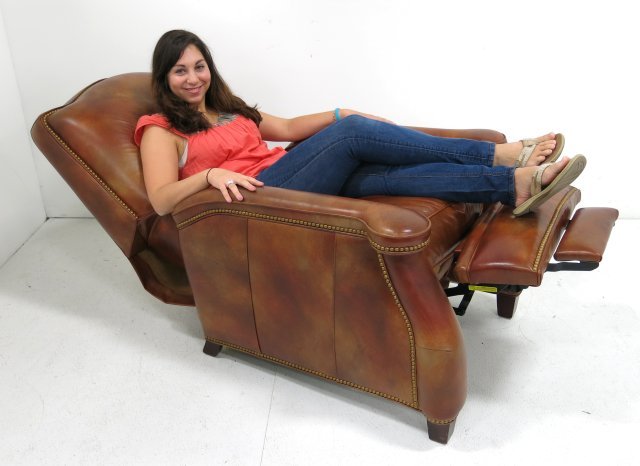 Brown leather recliner by Hancock & Moore: Approx. 42" H x 35" W x 36" D.