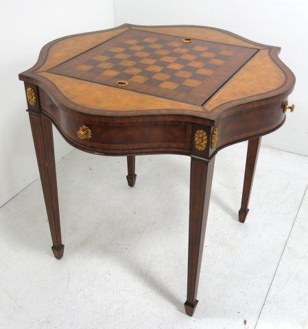 Maitland-Smith card table: Backgammon/chess gull leather footed. Approx. 34" H x 30" W.