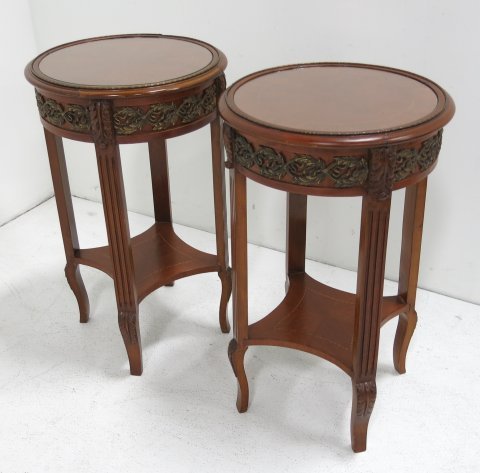 Pair of reproduction side tables: Bronze mounted round side tables with glass tops. Approx. 28" H x 17" W. Very good condition.