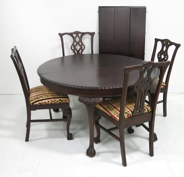 Round mahogany claw foot table: Gadroon edge. Including 4 Chippendale ball and claw chairs. Approx. 53" H Refinished.