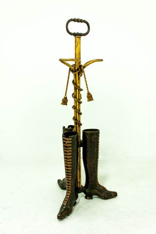 Unusual bronze umbrella stand: With tassels, "Shoe" motif. Approx. 32" H. Good condition.
