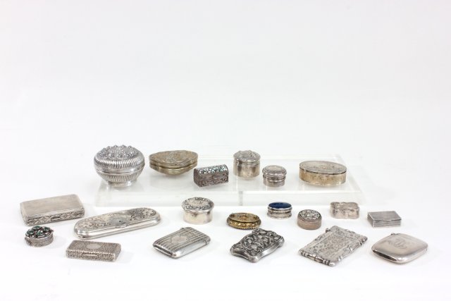 Collection of 20 silver items: Includes: Match safes, cigarette cases & pill boxes. Some decorated with mother of pearl or stones. Approx. 19.65 ozt. Assorted sizes. 800 sterling. Good condition.