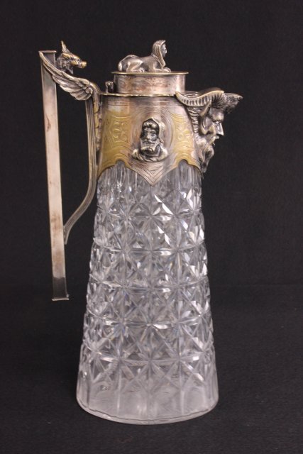 Cut glass & silver plate claret jug: With "Mask Heads of Men", "Sphinx" on lid & "Satyr" spout. Approx. 11 1/8" H. (3441) Good condition.