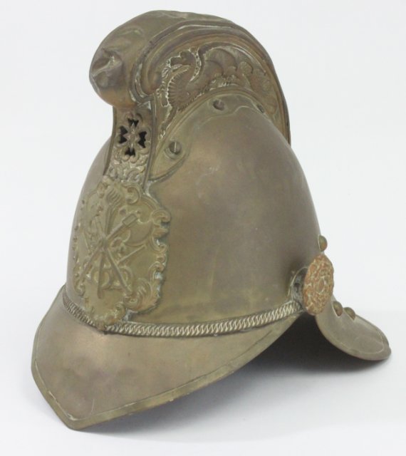 English brass "Fire Chief Helmet": With "Fire Breathing Dragon" design. Stitched leather insert. Dents.