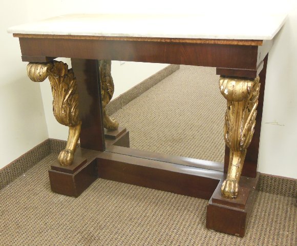 American marble top mahogany pier table: With mirror back bottom & guilt carved paw foot columns. Ca. 1840's Approx. 40" W x 17" D x 33" H. Good condition.