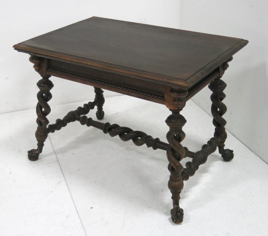 Antique carved mahogany table: With "Gone with the Wind" feet, twisted legs, library stretcher & drawer on side. Attributed to Hunzinger. Approx. 29" H x 40" W x 27" D. Good condition.