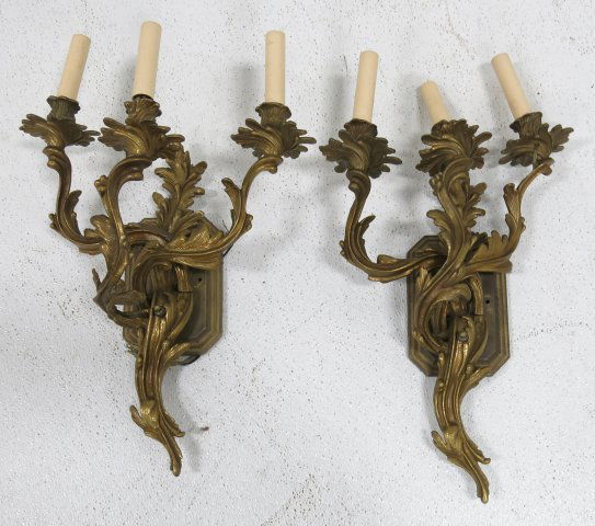 Pair 3 arm Louis XV Rococo style sconces: With back plates. Bronze. Approx 20" H x 14" W.